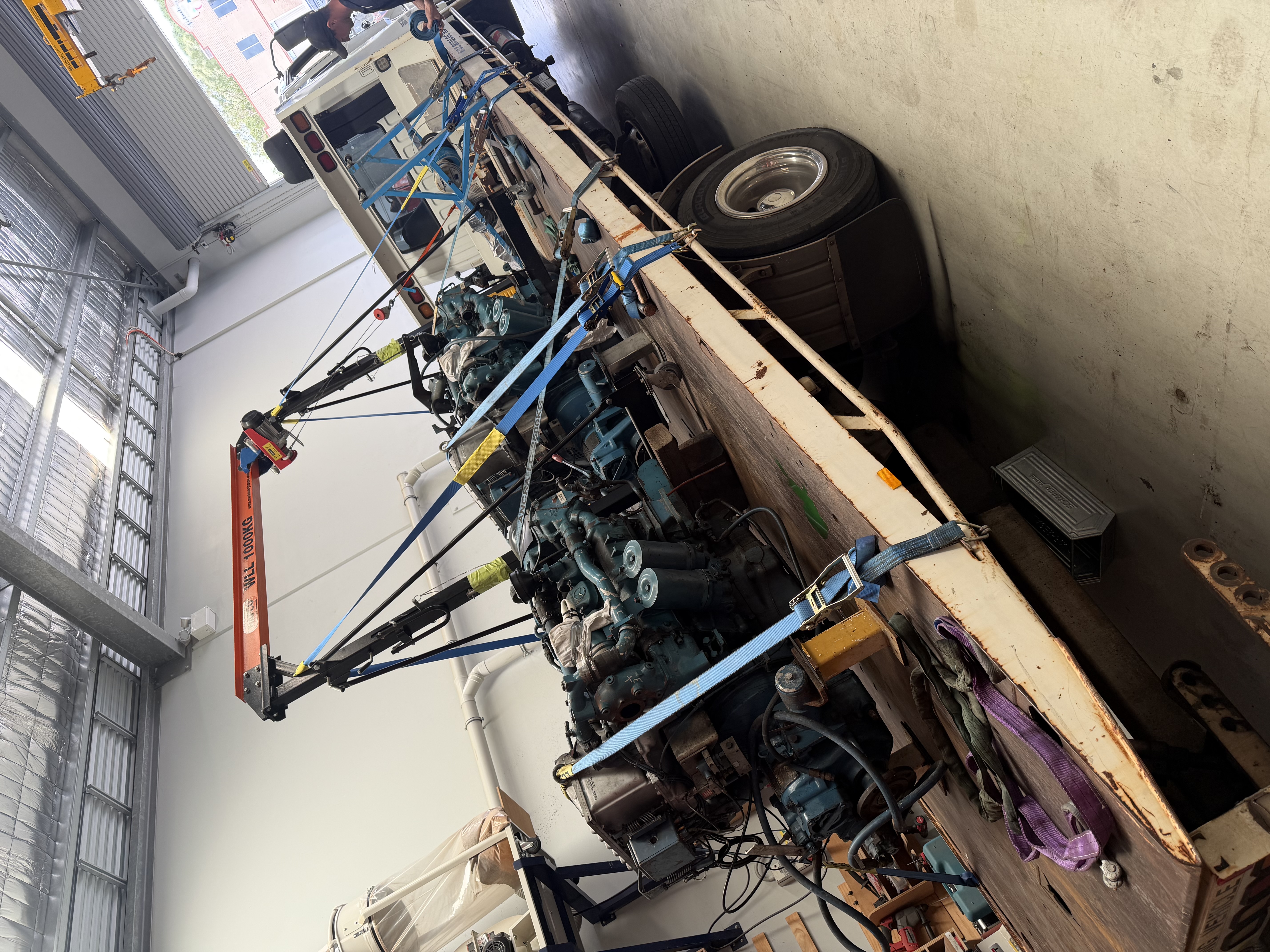 Engine assembly on flatbed truck in workshop