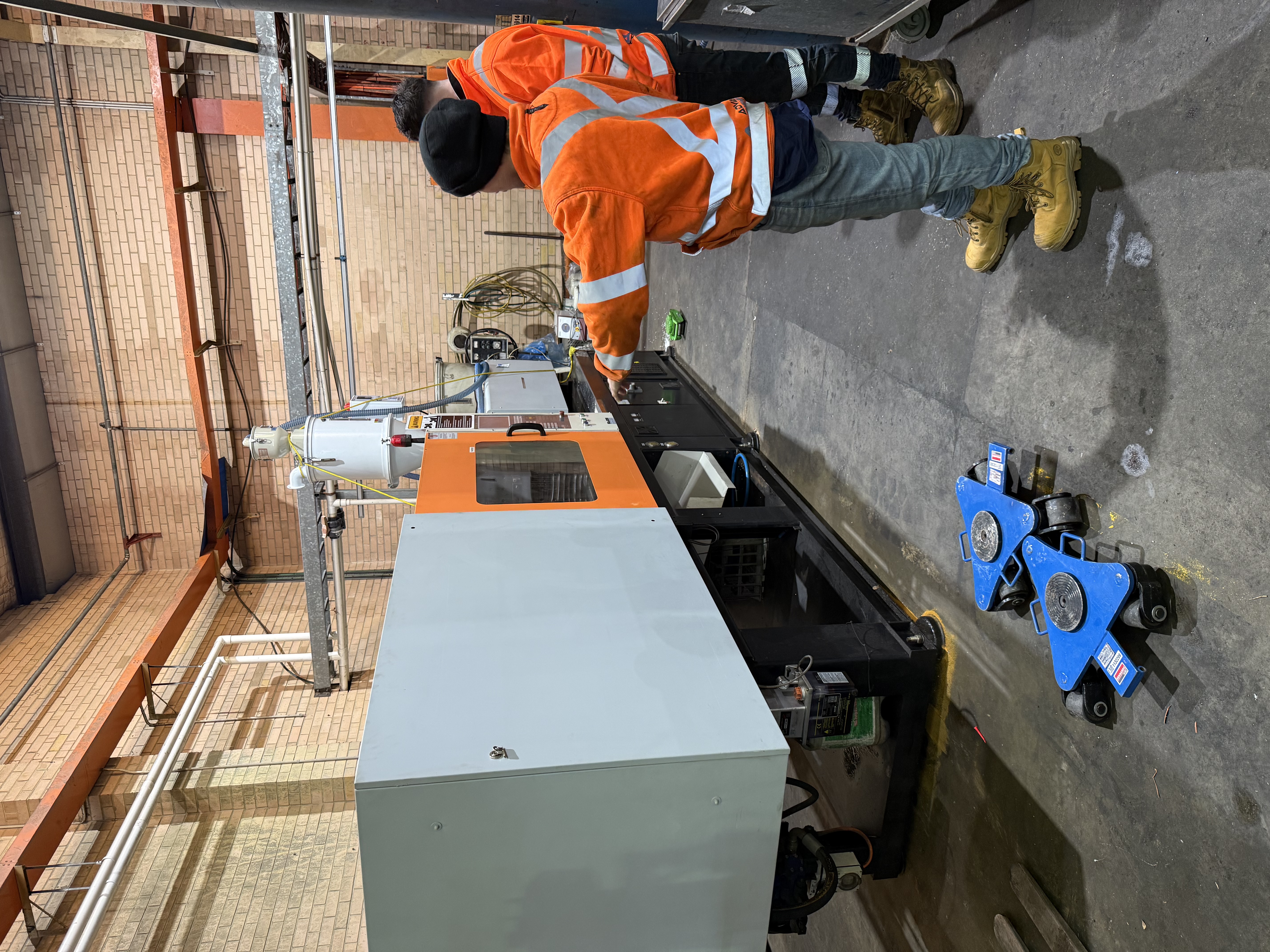 Technician servicing industrial plant equipment